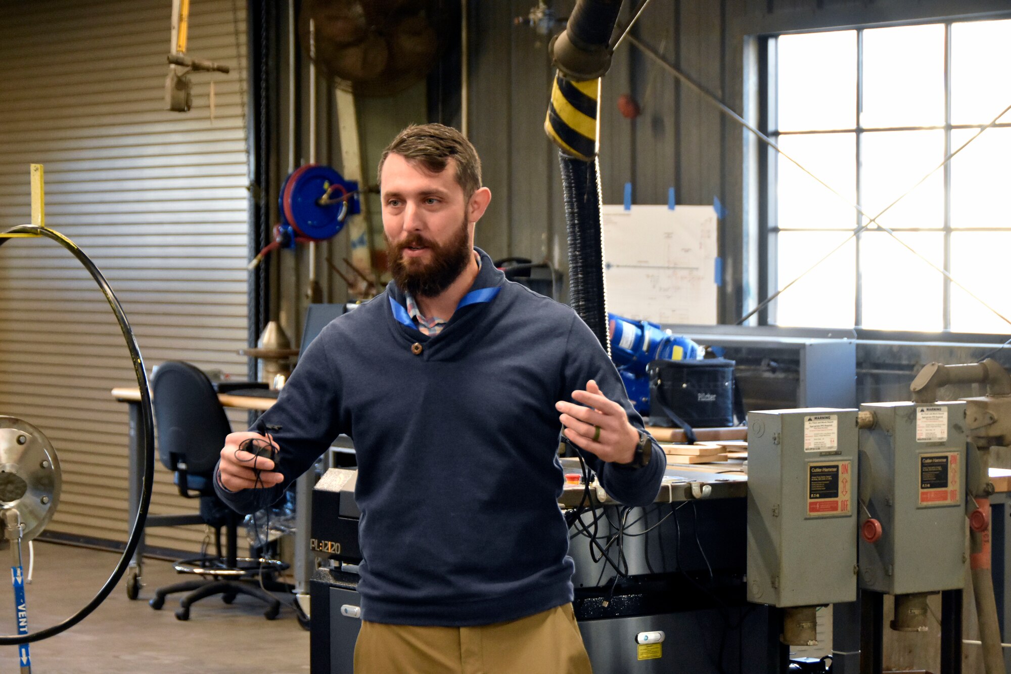 Arnold Engineering Development Complex Continuous Improvement Manager Pearson Brock talks about some of the resources offered to users of the Innovation Lab at Arnold Air Force Base, Tenn., during a Dec. 12, 2024, tour of the facility given for Airmen at Arnold. The Innovation Lab was recently reopened following a renovation, and the facility features 3D printing and scanning capabilities, a computer lab, an environmental chamber, a shock tube and a small-scale wind tunnel. (U.S. Air Force photo by Bradley Hicks)