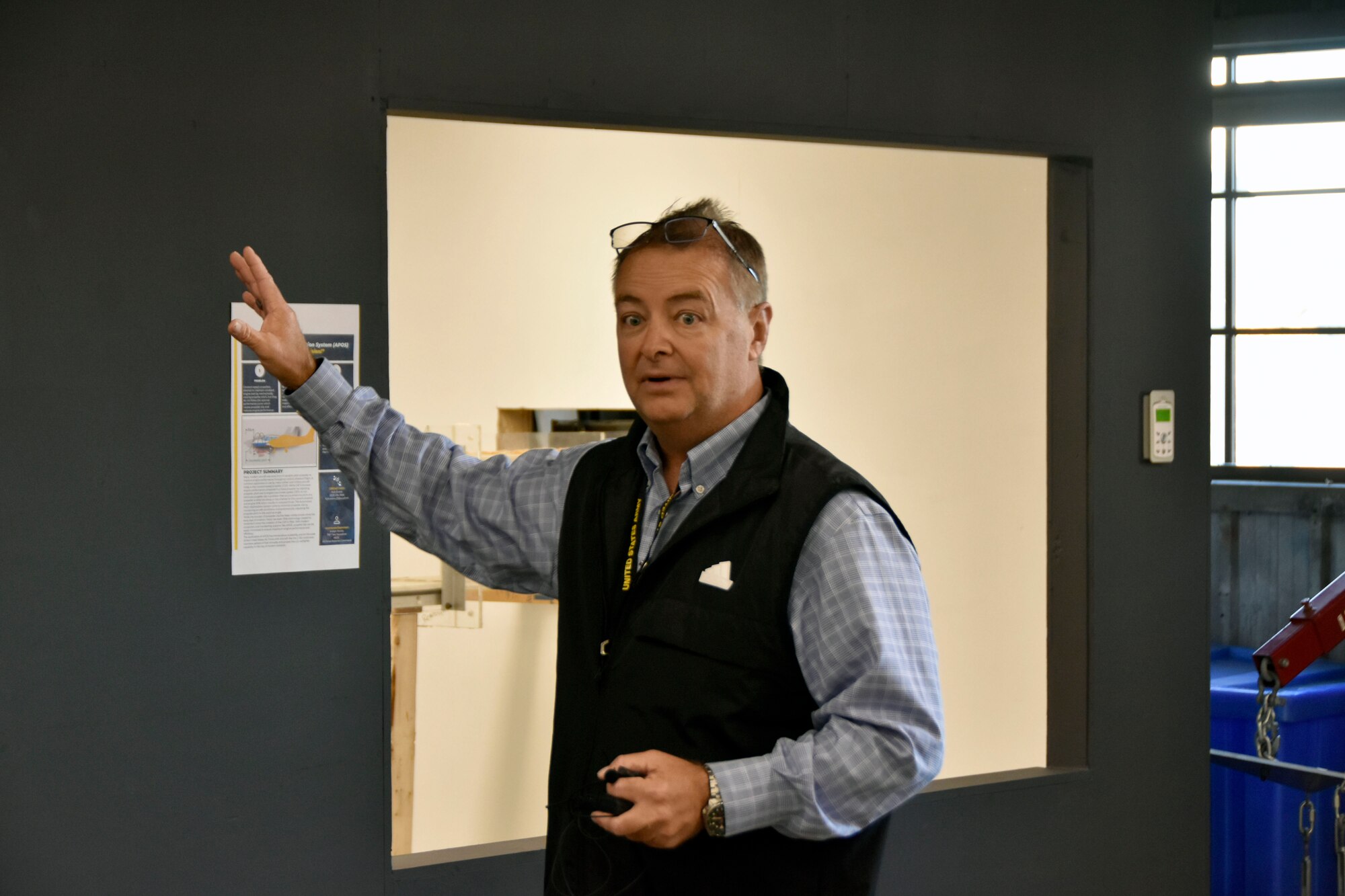 Arnold Engineering Development Complex Innovation Manager Aaron Allen discusses the small-scale wind tunnel located within the Innovation Lab at Arnold Air Force Base, Tenn., during a Dec. 12, 2024, tour of the facility given for Airmen at Arnold. The Innovation Lab was recently reopened following a renovation and offers users a place outside of the confines of the office to generate ideas, collaborate and experiment. (U.S. Air Force photo by Bradley Hicks)