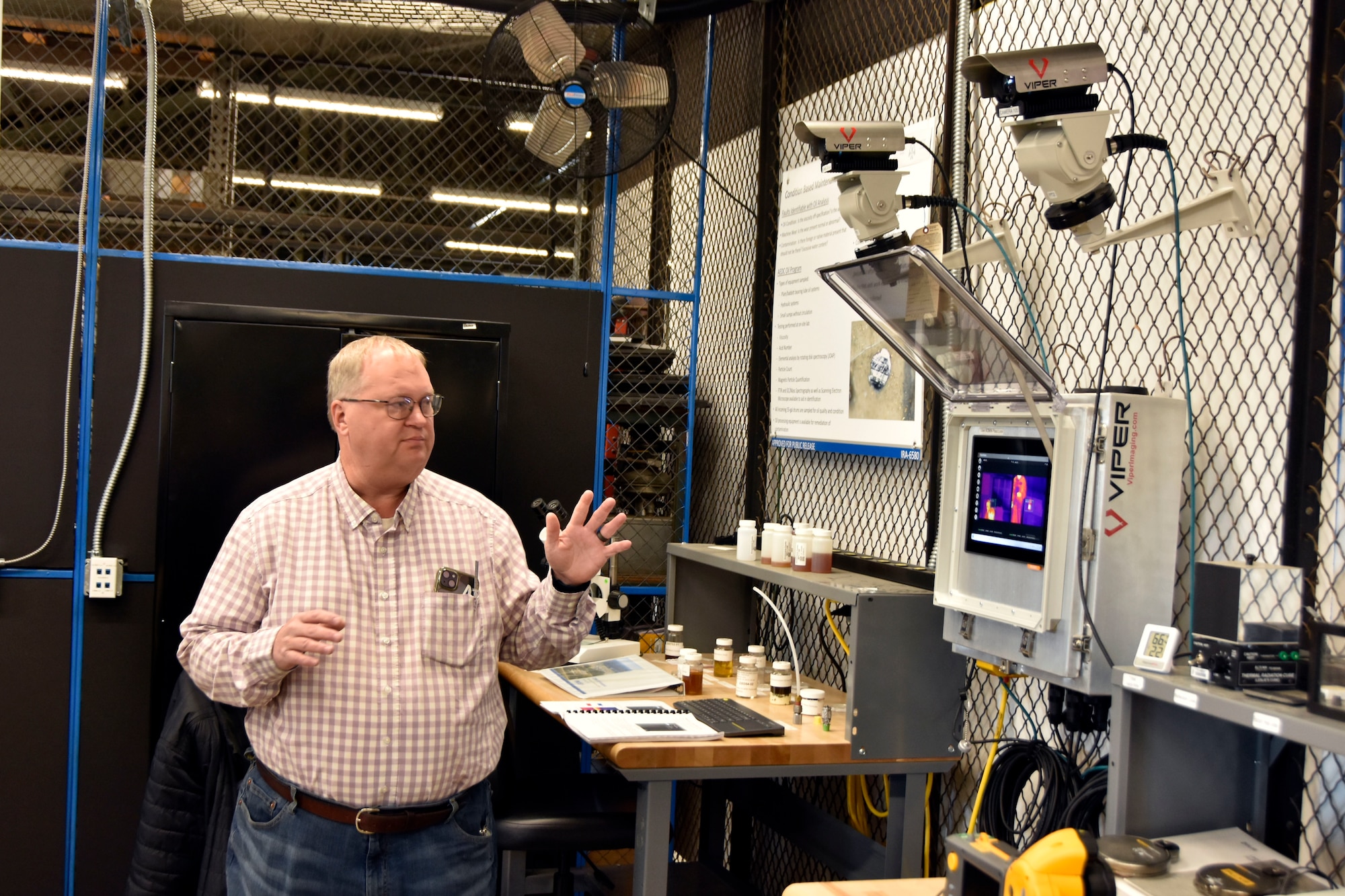 Dan Henley, a predictive maintenance manager at Arnold Air Force Base, discusses the infrared camera project for which he was awarded Arnold Engineering Development Complex Innovation Spark Tank program funding in early 2024. The system is currently on display in the Innovation Lab at Arnold AFB, Tenn., and Henley demonstrated the capability during a Dec. 12, 2024, tour of the facility given for Airmen at Arnold. The Innovation Lab was recently reopened following a renovation, and the facility features 3D printing and scanning capabilities, a computer lab, an environmental chamber, a shock tube and a small-scale wind tunnel. (U.S. Air Force photo by Bradley Hicks)