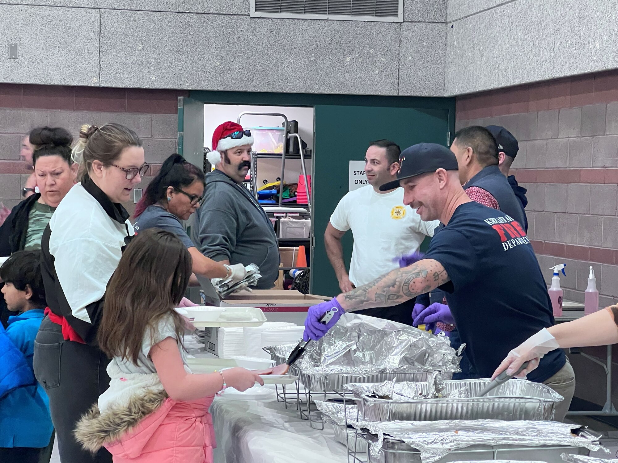 Kirtland Fire Fighters serve food to albuquerque families
