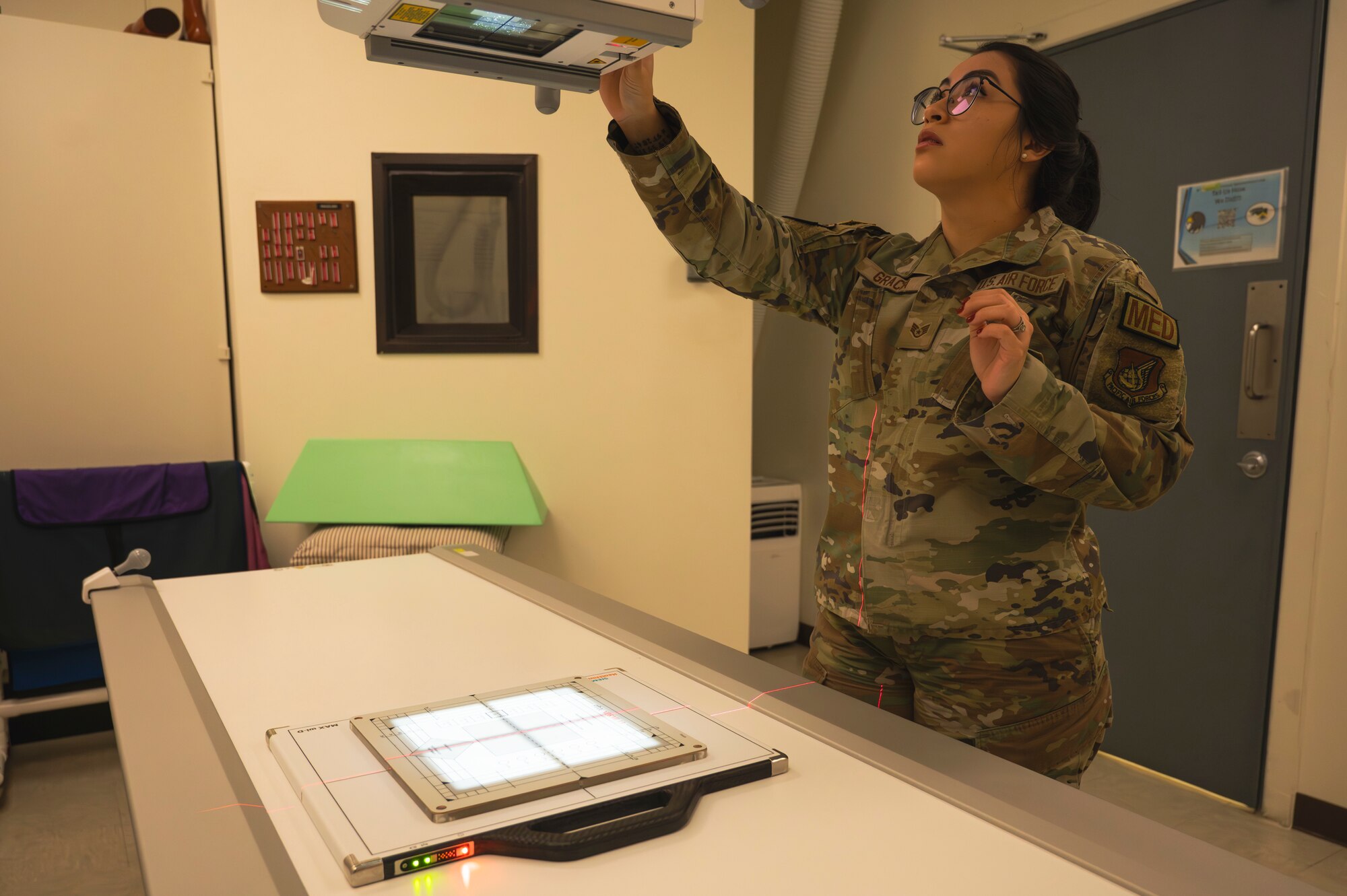 U.S. Air Force Staff Sgt. Kimberly Gracia, 8th Health Care Operations Squadron diagnostics & therapeutics non-commissioned officer in charge, calibrates an x-ray machine.