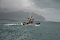 U.S. Navy Sailors with Waterfront Operations, Headquarters Battalion, Marine Corps Base Hawaii, respond to a no-notice call for action during a simulated fuel spill reaction drill, MCBH, Feb. 24, 2023. The drill consisted of a no-notice emergency call to respond to a notional fuel spill in Kaneohe Bay in which the priority was to contain and remove harmful toxins from the water. WFO provides MCBH with waterborne search and rescue capabilities and serves as the installation’s emergency response team. (U.S. Marine Corps photo by Cpl. Holly Moore)