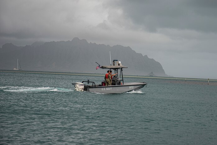 U.S. Navy Sailors with Waterfront Operations, Headquarters Battalion, Marine Corps Base Hawaii, respond to a no-notice call for action during a simulated fuel spill reaction drill, MCBH, Feb. 24, 2023. The drill consisted of a no-notice emergency call to respond to a notional fuel spill in Kaneohe Bay in which the priority was to contain and remove harmful toxins from the water. WFO provides MCBH with waterborne search and rescue capabilities and serves as the installation’s emergency response team. (U.S. Marine Corps photo by Cpl. Holly Moore)