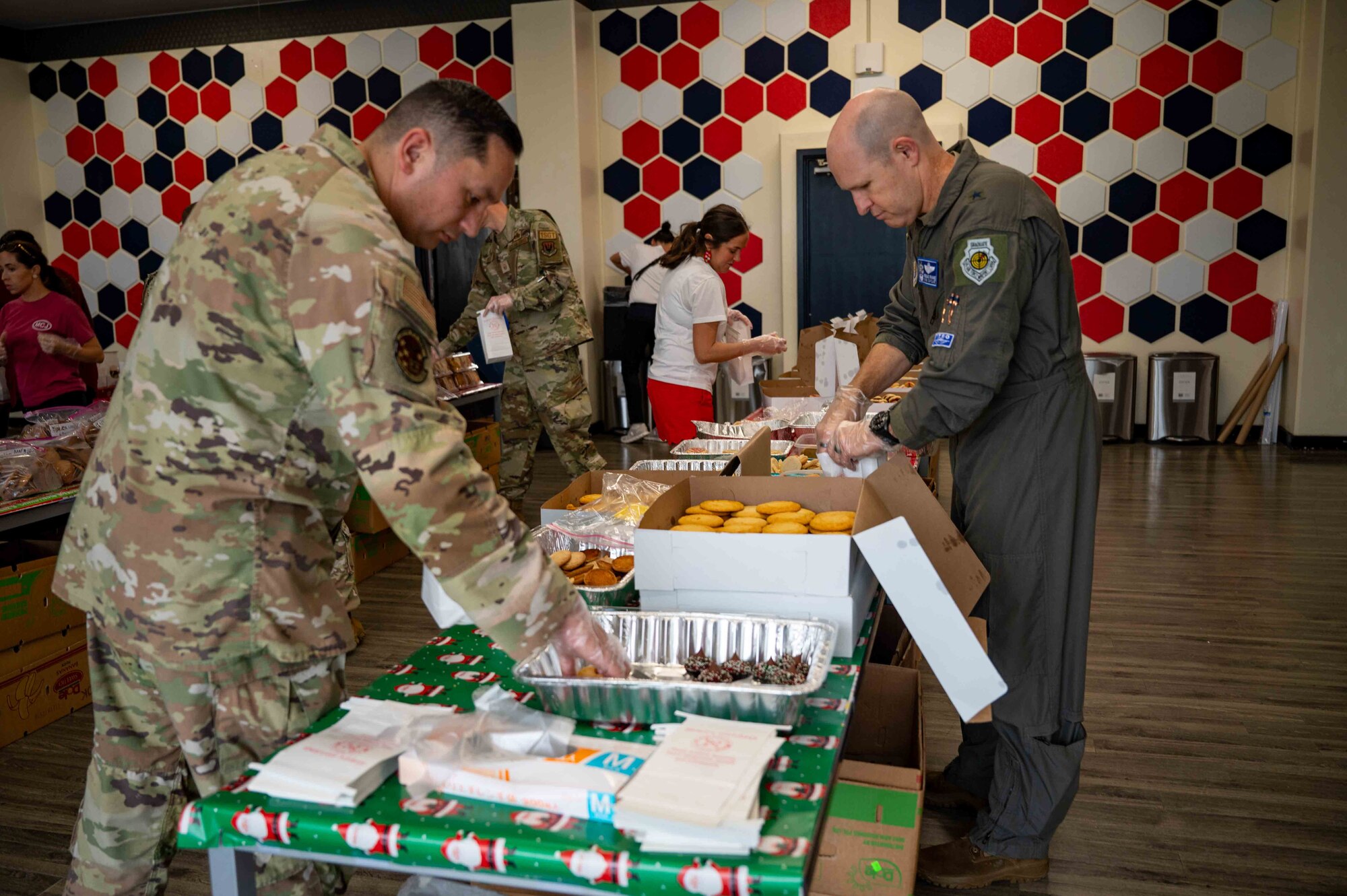 two military members fill cookie bags