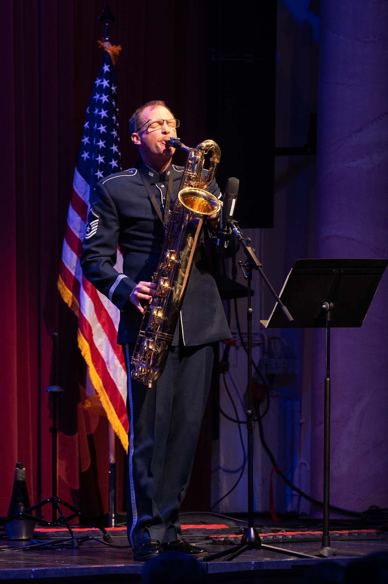 U.S. Air Force Master Sgt. Nathan Held, U.S. Air Forces in Europe - Air Forces Africa Band baritone saxophonist, performs a solo during the Kaiserslautern Military Community Christmas concert at the Fruchthalle in Kaiserslautern, Germany, Dec. 13, 2024. These concerts offer a platform for cultural exchange and sharing of musical traditions between the U.S. Air Force musicians and European audiences. (U.S. Air Force photo by Senior Airman Renan Arredondo)