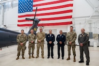 Lt. Gen. Carlos Enrique Chavez Cateriano, the Peruvian Air Force Chief of Staff, and Peruvian Air Force Senior Enlisted Leader Tecnico Supervisor Mayor Walter Silva stand surrounded by leaders from the Inter-American Air Forces Academy
