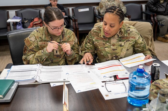 The 375th Air Mobility Wing conducted a tabletop Public Emergency Exercise with Scott Air Force Base mission partners on Dec. 13, 2024. This simulated emergency included representatives from United States Transportation Command, Surface Deployment & Distribution Command, Defense Information System Agency, Defense Information Technology Contracting Organization, the 126th Air Refueling Wing, the 932nd Airlift Wing and the St. Clair County Health Department. (U.S. Air Force photo by Rachel Sansano)