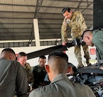 Sgt. Tony Ramirez, crew chief, 1st Battalion, 168th General Support Aviation, talks about the UH-60 Black Hawk helicopter with soldiers from the 9th Battalion, Royal Thai Army during an aviation subject matter exchange in Lop Buri, Thailand, Dec. 2, 2024. The Washington National Guard and Thailand are State Partnership Program partners.