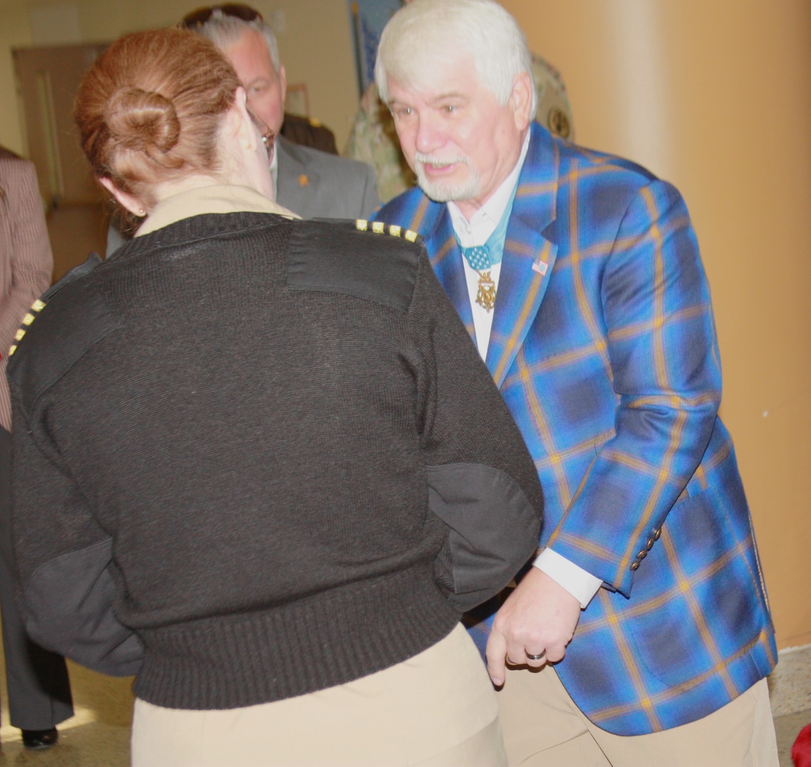 U.S. Navy CAPT (Dr.) Melissa Austin, director of Walter Reed National Military Medical Center, welcomes Medal of Honor recipients to WRNMMC to visit with patients and staff on Dec. 13, 2024.