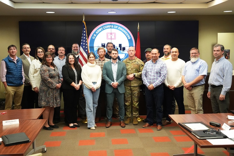 Gratuates of the U.S. Army Corps of Engineers Nashville's 2024 Supervisor Training Program pose for a photo with Maj. Jesse Davis, Nashville District deputy commander, at the district office building in Nashville, Tennessee, Dec. 12, 2024. Designed and overseen by veteran supervisors and subject matter experts, this nine-month program reflects the district's continued investment in its people by developing leadership skills and enhancing operational effectiveness.