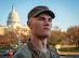 An Airman looking off into the distance with the U.S. Capitol building in the background