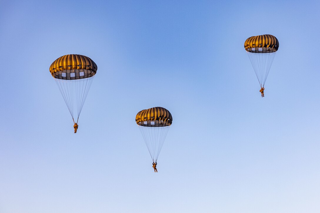 U.S. Marines with 1st Platoon, Maritime Special Purpose Force, 22nd Marine Expeditionary Unit, conduct a static line jump during military freefall sustainment training in Laurinburg, North Carolina on Dec. 4, 2024. U.S. Marines with the 22nd MEU, MSPF, execute military freefall sustainment training to maintain insertion qualifications, enhance proficiency and ensure tactical readiness for the 22nd MEU’s upcoming Pre-Deployment Training Program and follow on operations. (U.S. Marine Corps photo by Sgt. Nathan Mitchell)