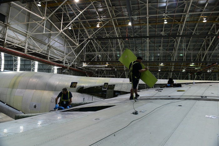 Maintainers work on a C-5 aircraft