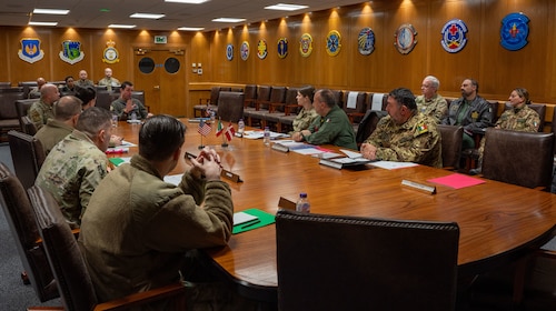 group talking at conference room table