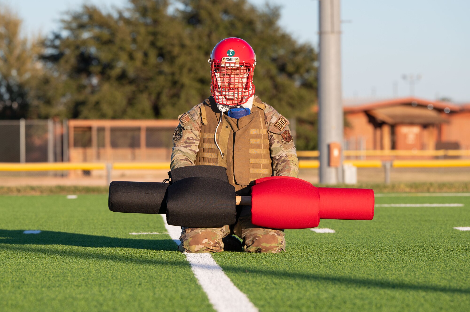 U.S. Air Force Airman 1st Class James Hostetler, Marine Corps Martial Arts Program student, sits with pugil sticks during MCMAP at Dyess Air Force Base, Texas, Nov. 21, 2024. The program is a weapons-based system that combines combat equipment, physical challenges and tactics typically found in the combat arena. (U.S. Air Force photo by Airman 1st Class Emma Anderson)