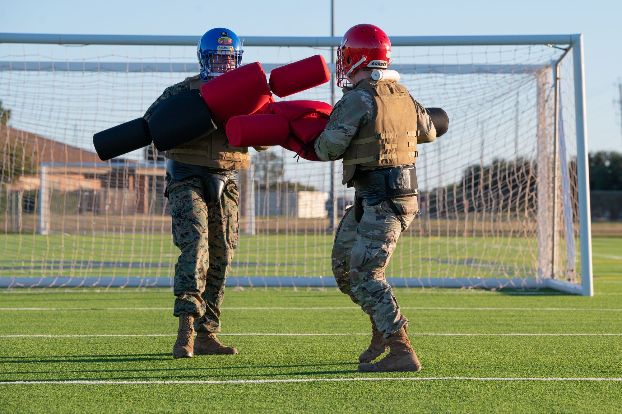 U.S. Air Force Airman 1st Class James Hostetler and a U.S. Marine Corps Marine, Marine Corps Martial Arts Program students, practice fighting techniques with pugil sticks during MCMAP at Dyess Air Force Base, Texas, Nov. 21, 2024. The program is a weapons-based system that combines combat equipment, physical challenges and tactics typically found in the combat arena. (U.S. Air Force photo by Airman 1st Class Emma Anderson)