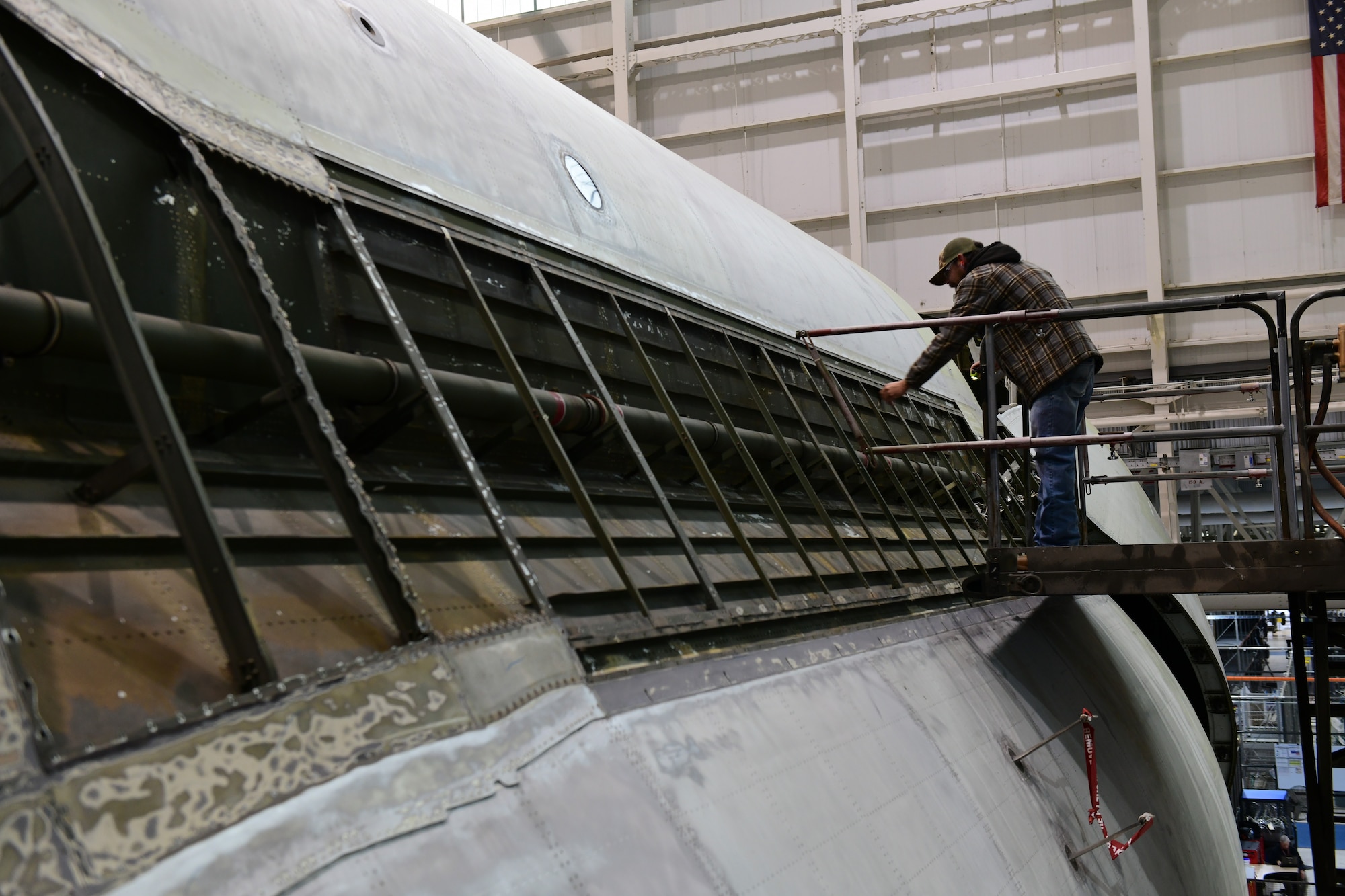 A maintainer works on a C-5 aircraft