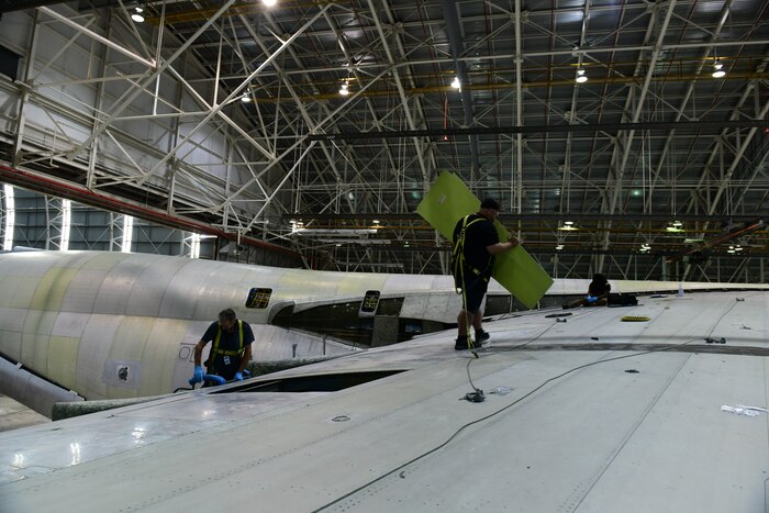 Maintainers work on a C-5 aircraft