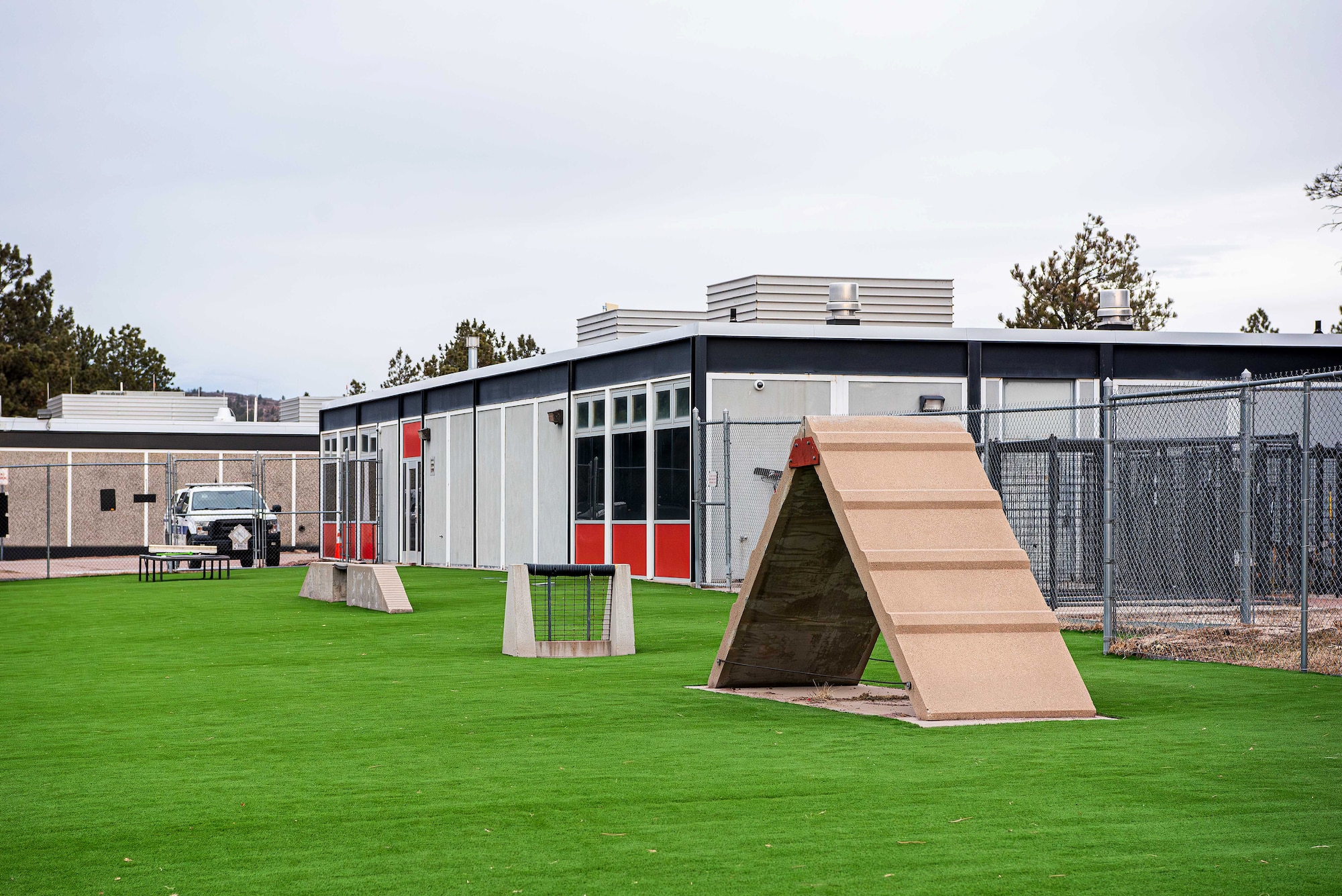 The 10th Security Forces Squadron recently completed a $140,000 upgrade to the Military Working Dog obedience yard, installing state-of-the-art turf to enhance the training environment for both handlers and their canine partners. The improved surface significantly reduces the likelihood of injuries such as twisted ankles or strained joints, ensuring teams can train effectively without unnecessary setbacks. (U.S. Air Force photo by Trevor Cokley)