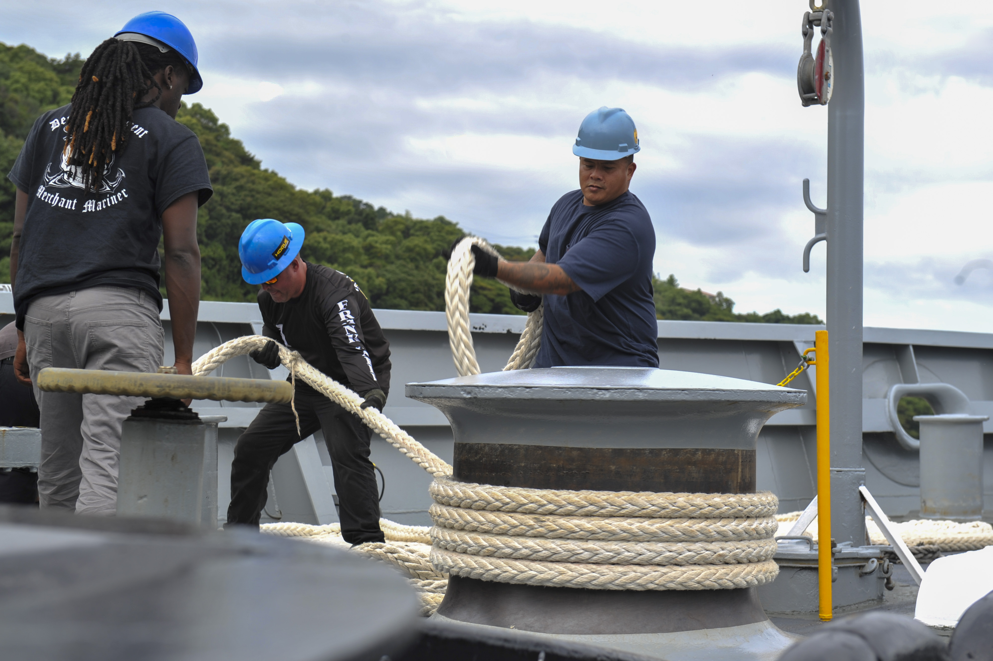 Military Sealift Command civil service mariner Joe Marges, assigned to the forward-deployed U.S. Navy submarine tender USS Frank Cable (AS 40), wraps lines around a capstan as the ship arrives in Sasebo, Oct. 14, 2024. Frank Cable is supporting the U.S. 7th Fleet, the U.S. Navy’s largest forward deployed numbered fleet, operating with allies and partners in preserving a free and open Indo-Pacific region. Frank Cable, forward-deployed to the island of Guam, repairs, rearms, and re-provisions submarines and surface vessels in the Indo-Pacific region.