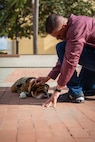 U.S. Marine Corps Mascot of Marine Corps Recruit Depot San Diego and the Western Recruiting Region, Lance Cpl. Bruno, meets the staff from John F. Kennedy High School's Marine Corps Junior ROTC program at Marine Corps Recruit Depot San Diego, Dec. 12, 2024. The mascot’s job is to boost morale, participate in outreach work and attend events and ceremonies. (U.S. Marine Corps photo by Cpl. Francisco Angel)