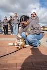 U.S. Marine Corps Mascot of Marine Corps Recruit Depot San Diego and the Western Recruiting Region, Lance Cpl. Bruno, meets the students with John F. Kennedy High School's Marine Corps Junior ROTC program at Marine Corps Recruit Depot San Diego, Dec. 12, 2024. The mascot’s job is to boost morale, participate in outreach work and attend events and ceremonies. (U.S. Marine Corps photo by Cpl. Francisco Angel)