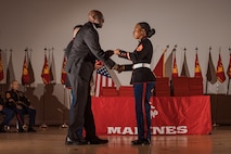 Retired U.S. Marine Corps Master Gunnery Sgt. William Barr, the guest of honor, gives the graduation certificates during the Basic Recruiter’s Course 1-25 graduation at Marine Corps Recruit Depot San Diego, California, Dec. 13, 2024. The mission of the BRC is to provide staff noncommissioned officers and noncommissioned officers the basic skills and knowledge in order to successfully inform young men and women about the opportunities and career paths the Marine Corps has to offer. (U.S. Marine Corps photo by Lance Cpl. Janell B. Alvarez)