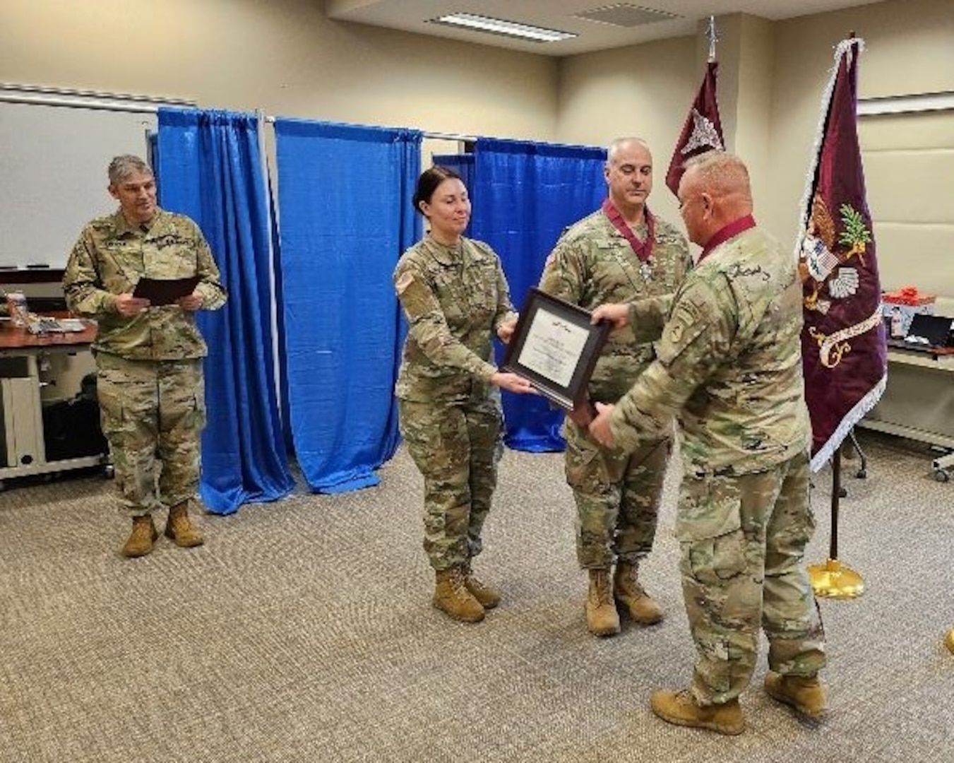 Left to Right: Col. Frederick Looper, commander of the Medical Readiness Unit, Maine Army National Guard; 1st Sgt. Jayme Saucier, first sergeant of the MRU; Lt. Col. Joel Dunn, deputy state surgeon, MEARNG; Col. George Horsley, state surgeon general, Massachusetts Army National Guard; as Dunn becomes the first person in the Maine Army National Guard to be inducted into the Order of Military Medical Merit Dec. 8, 2024 in Bangor, Maine. The order was founded by the commanding general of the U.S. Army Health Services Command in 1982 to recognize excellence and promote fellowship and esprit de corps among Army Medical Department personnel.