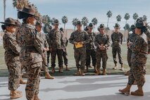U.S. Marine Corps Drill Instructors, with Fox Company, 2nd Recruit Training Battalion, get briefed before a company commander’s inspection at Marine Corps Recruit Depot San Diego, California, Dec. 14, 2024. The company commander’s inspection surveys new Marines for knowledge, bearing, and attention to detail before the battalion commander’s inspection, one of their last tests before graduating. (U.S. Marine Corps photo by Lance Cpl. Janell B. Alvarez)