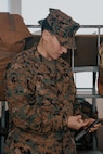 U.S. Marine Corps Follow Series Commander, Capt. Alex Arnold, with Fox Company, 2nd Recruit Training Battalion, inspects a rifle during a company commander’s inspection at Marine Corps Recruit Depot San Diego, California, Dec. 14, 2024. The company commander’s inspection surveys new Marines for knowledge, bearing, and attention to detail before the battalion commander’s inspection, one of their last tests before graduating. (U.S. Marine Corps photo by Lance Cpl. Janell B. Alvarez)