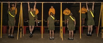 U.S. Marine Corps recruits with Echo Company, 2nd Recruit Training Battalion, execute the pull-up portion of a physical fitness test at Marine Corps Recruit Depot San Diego, California, Dec. 16, 2024. The PFT is an evaluation that all recruits must pass and sets the standards all Marines must maintain once a year to assess battle readiness as well as physical conditioning. The Marine Corps is a professional, disciplined, and capable force. Honor, courage, and commitment are seen and felt in the shared experiences, hardships and challenges we face together in training, and in combat. These values embody what it is to be a Marine, and they live in the collective soul of our Corps. (U.S. Marine Corps photo by Lance Cpl. Janell B. Alvarez)