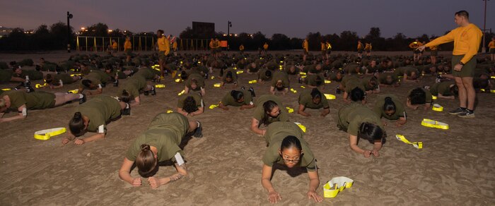 U.S. Marine Corps recruits with Echo Company, 2nd Recruit Training Battalion, execute the plank portion of a physical fitness test at Marine Corps Recruit Depot San Diego, California, Dec. 16, 2024. The PFT is an evaluation that all recruits must pass and sets the standards all Marines must maintain once a year to assess battle readiness as well as physical conditioning. The Marine Corps is a professional, disciplined, and capable force. Honor, courage, and commitment are seen and felt in the shared experiences, hardships and challenges we face together in training, and in combat. These values embody what it is to be a Marine, and they live in the collective soul of our Corps. (U.S. Marine Corps photo by Lance Cpl. Janell B. Alvarez)