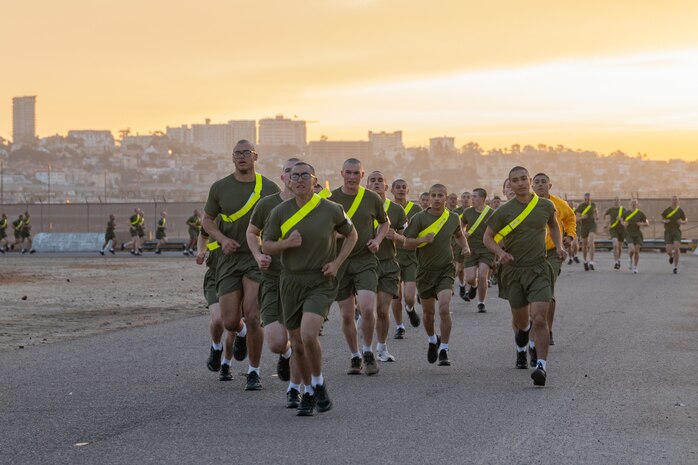 U.S. Marine Corps recruits with Echo Company, 2nd Recruit Training Battalion, execute the three-mile run portion of a physical fitness test at Marine Corps Recruit Depot San Diego, California, Dec. 16, 2024. The PFT is an evaluation that all recruits must pass and sets the standards all Marines must maintain once a year to assess battle readiness as well as physical conditioning. The Marine Corps is a professional, disciplined, and capable force. Honor, courage, and commitment are seen and felt in the shared experiences, hardships and challenges we face together in training, and in combat. These values embody what it is to be a Marine, and they live in the collective soul of our Corps. (U.S. Marine Corps photo by Lance Cpl. Janell B. Alvarez)