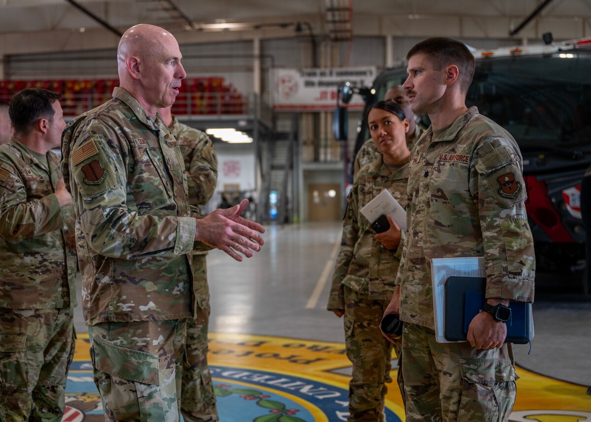 U.S. Air Force Maj. Gen. Clerk Quinn, Air Education and Training Command deputy commander, talks with Lt. Col. Branden DeLong, 312th Training Squadron commander, during a tour at Goodfellow Air Force Base, Texas, Dec. 17, 2024. Quinn learned how the 312th TRS trains, develops and inspires warriors to deliver fire emergency services and nuclear treaty monitoring for the Department of Defense and our international partners. (U.S. Air Force photo by Senior Airman Sarah Williams)