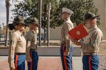 U.S. Marine Corps Drill Instructors, Staff Sgt. Burruel Delacruz, front left, and Staff Sgt. Barry Clayton, back left, both with Charlie Company, 1st Recruit Training Battalion, are presented a Navy and Marine Corps Achievement Medal at Marine Corps Recruit Depot San Diego, California, Dec. 13, 2024. A NAM is given to members of the U.S. Navy and Marine Corps for meritorious service or achievement. Delacruz and Clayton received a NAM for exemplifying unrivaled courage and extraordinary presence of mind when confronting a life-threatening emergency. The words “drill instructor, drill instructor, drill instructor” were called and Delacruz and Clayton sprang into action to save a fourteen-month-old infant who was unconscious and not breathing. Providing CPR and proper throat sweeping techniques they successfully dislodged the obstruction and the infant regained consciousness. Likely saving baby Aisla’s life.  The family of the infant was onsite during the ceremony and presented the awards. The Marine Corps has served the Nation honorably for 250 years. Marines embody the uncompromising standards and characteristics of honor, courage and commitment.