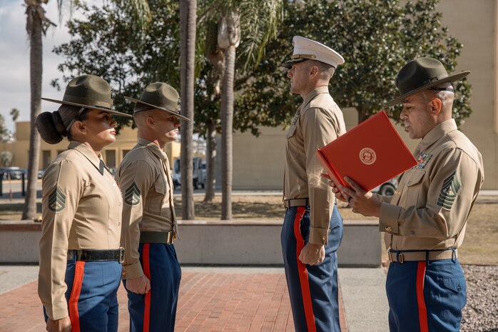 U.S. Marine Corps Drill Instructors, Staff Sgt. Burruel Delacruz, front left, and Staff Sgt. Barry Clayton, back left, both with Charlie Company, 1st Recruit Training Battalion, are presented a Navy and Marine Corps Achievement Medal at Marine Corps Recruit Depot San Diego, California, Dec. 13, 2024. A NAM is given to members of the U.S. Navy and Marine Corps for meritorious service or achievement. Delacruz and Clayton received a NAM for exemplifying unrivaled courage and extraordinary presence of mind when confronting a life-threatening emergency. The words “drill instructor, drill instructor, drill instructor” were called and Delacruz and Clayton sprang into action to save a fourteen-month-old infant who was unconscious and not breathing. Providing CPR and proper throat sweeping techniques they successfully dislodged the obstruction and the infant regained consciousness. Likely saving baby Aisla’s life.  The family of the infant was onsite during the ceremony and presented the awards. The Marine Corps has served the Nation honorably for 250 years. Marines embody the uncompromising standards and characteristics of honor, courage and commitment.