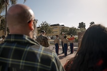 The family of baby Aisla observes U.S. Marine Corps Drill Instructors, Staff Sgt. Burruel Delacruz, front left, and Staff Sgt. Barry Clayton, back left, both with Charlie Company, 1st Recruit Training Battalion, are presented a Navy and Marine Corps Achievement Medal at Marine Corps Recruit Depot San Diego, California, Dec. 13, 2024. A NAM is given to members of the U.S. Navy and Marine Corps for meritorious service or achievement. Delacruz and Clayton received a NAM for exemplifying unrivaled courage and extraordinary presence of mind when confronting a life-threatening emergency. The words “drill instructor, drill instructor, drill instructor” were called and Delacruz and Clayton sprang into action to save a fourteen-month-old infant who was unconscious and not breathing. Providing CPR and proper throat sweeping techniques they successfully dislodged the obstruction and the infant regained consciousness. Likely saving baby Aisla’s life.  The family of the infant was onsite during the ceremony and presented the awards. The Marine Corps has served the Nation honorably for 250 years. Marines embody the uncompromising standards and characteristics of honor, courage and commitment.