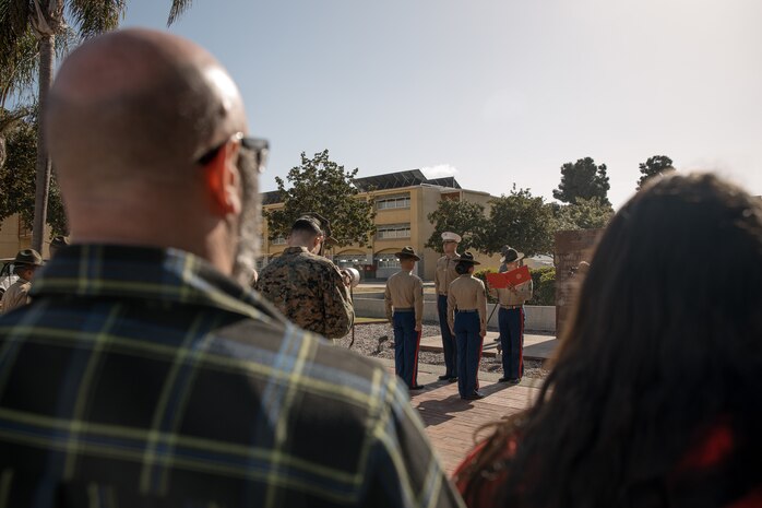 The family of baby Aisla observes U.S. Marine Corps Drill Instructors, Staff Sgt. Burruel Delacruz, front left, and Staff Sgt. Barry Clayton, back left, both with Charlie Company, 1st Recruit Training Battalion, are presented a Navy and Marine Corps Achievement Medal at Marine Corps Recruit Depot San Diego, California, Dec. 13, 2024. A NAM is given to members of the U.S. Navy and Marine Corps for meritorious service or achievement. Delacruz and Clayton received a NAM for exemplifying unrivaled courage and extraordinary presence of mind when confronting a life-threatening emergency. The words “drill instructor, drill instructor, drill instructor” were called and Delacruz and Clayton sprang into action to save a fourteen-month-old infant who was unconscious and not breathing. Providing CPR and proper throat sweeping techniques they successfully dislodged the obstruction and the infant regained consciousness. Likely saving baby Aisla’s life.  The family of the infant was onsite during the ceremony and presented the awards. The Marine Corps has served the Nation honorably for 250 years. Marines embody the uncompromising standards and characteristics of honor, courage and commitment.