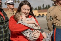 Baby Aisla and her mom observe U.S. Marine Corps Drill Instructors, Staff Sgt. Burruel Delacruz, front left, and Staff Sgt. Barry Clayton, back left, both with Charlie Company, 1st Recruit Training Battalion, are presented a Navy and Marine Corps Achievement Medal at Marine Corps Recruit Depot San Diego, California, Dec. 13, 2024. A NAM is given to members of the U.S. Navy and Marine Corps for meritorious service or achievement. Delacruz and Clayton received a NAM for exemplifying unrivaled courage and extraordinary presence of mind when confronting a life-threatening emergency. The words “drill instructor, drill instructor, drill instructor” were called and Delacruz and Clayton sprang into action to save a fourteen-month-old infant who was unconscious and not breathing. Providing CPR and proper throat sweeping techniques they successfully dislodged the obstruction and the infant regained consciousness. Likely saving baby Aisla’s life.  The family of the infant was onsite during the ceremony and presented the awards. The Marine Corps has served the Nation honorably for 250 years. Marines embody the uncompromising standards and characteristics of honor, courage and commitment.