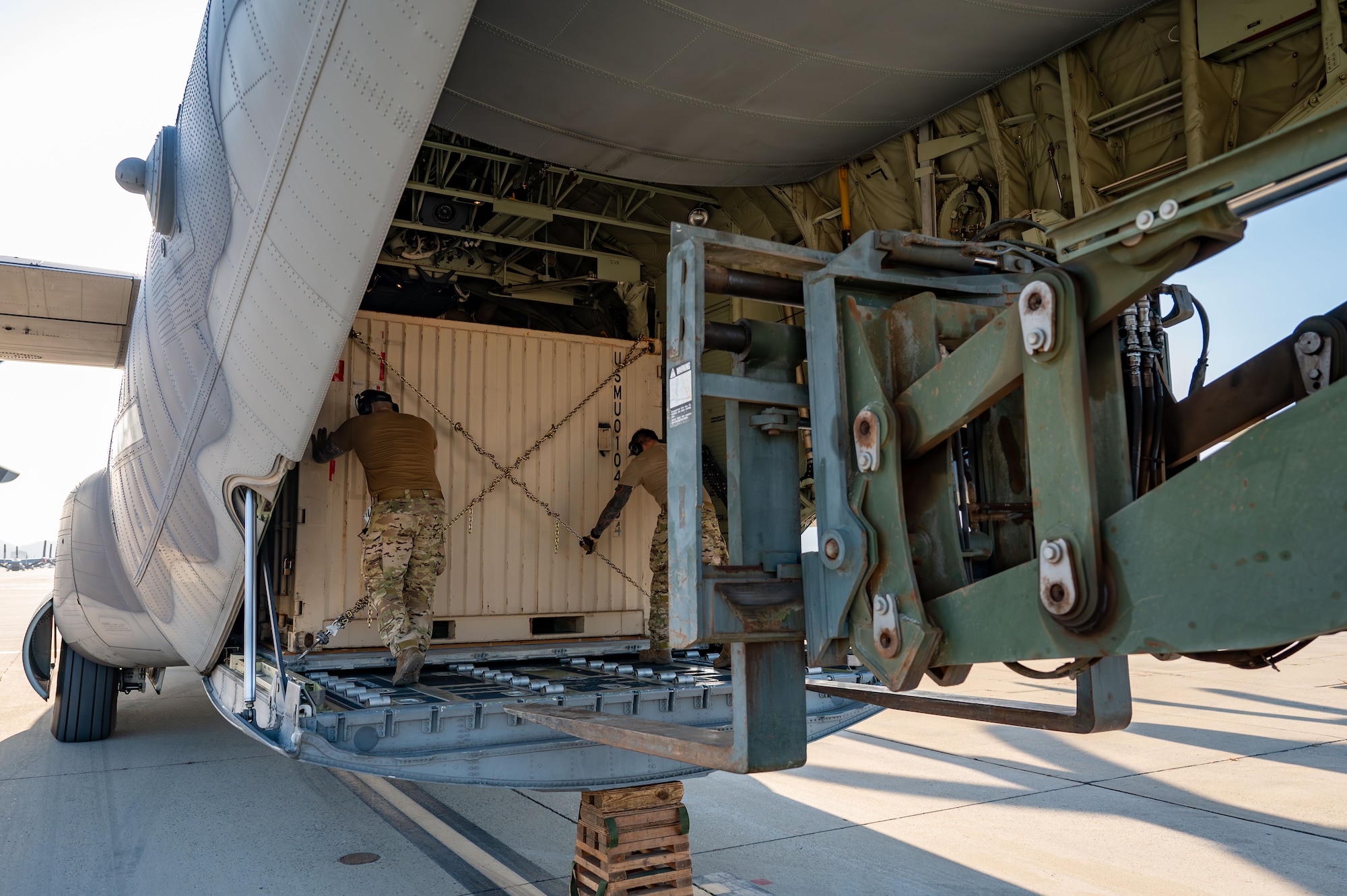 U.S. Air Force combat rescue loadmasters load QuadCons