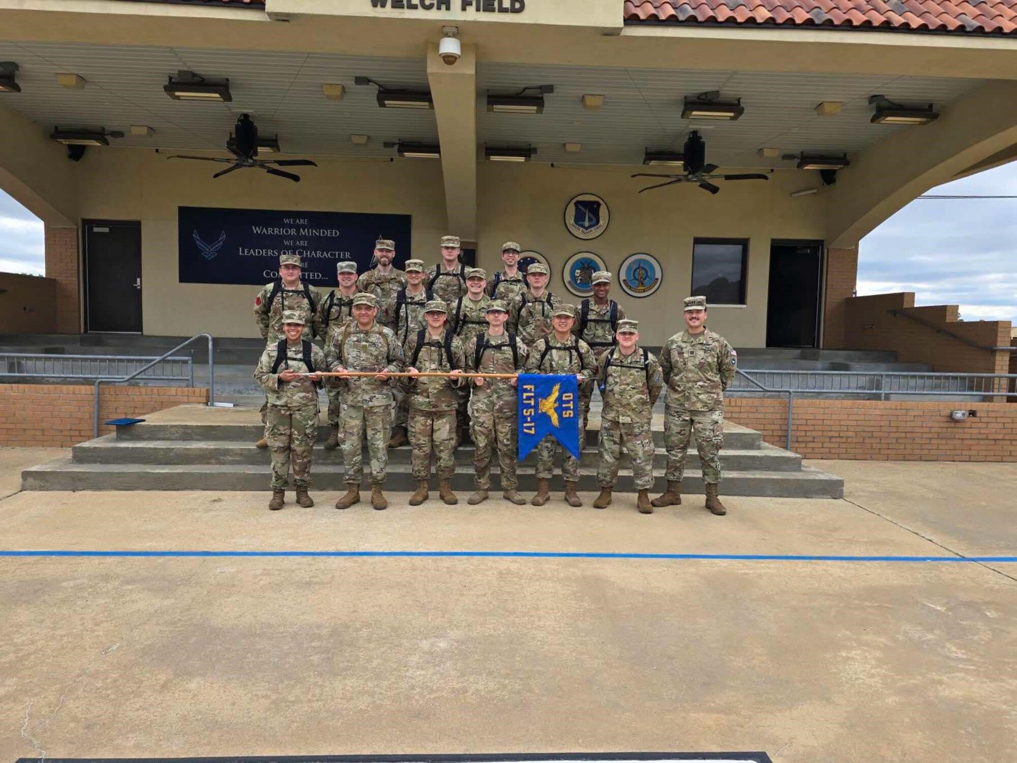 Group of military members pose for group photo