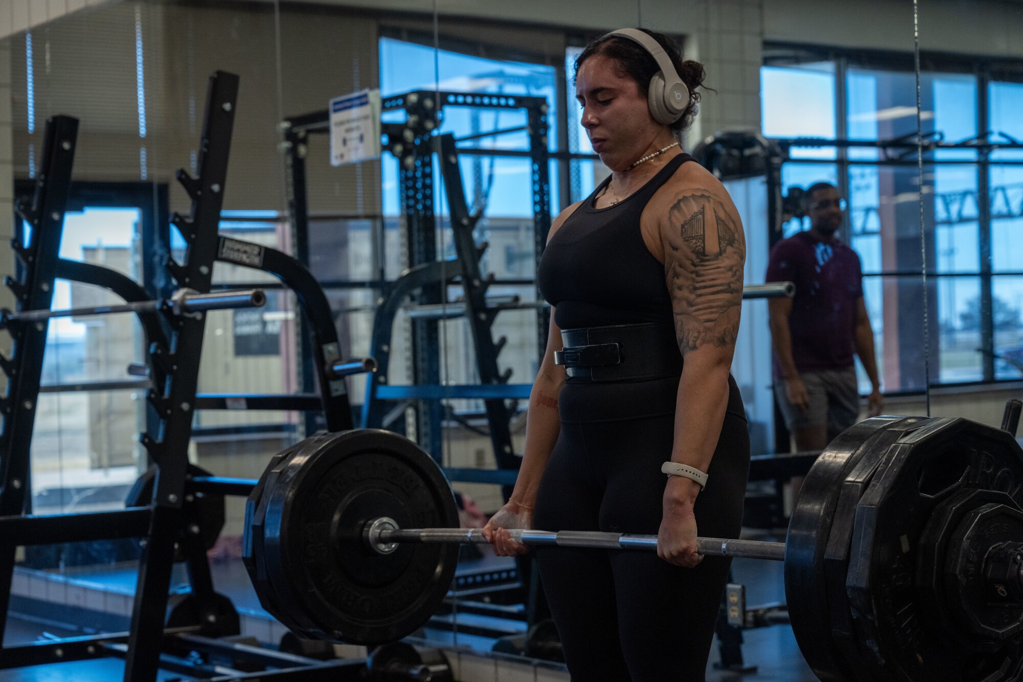 A Team McConnell Airman performs a deadlift during a base weightlifting competition Dec. 11, 2024, at McConnell Air Force Base, Kansas. The Airman won first place in the female category. (U.S. Air Force photo by Airman 1st Class Paula Arce)