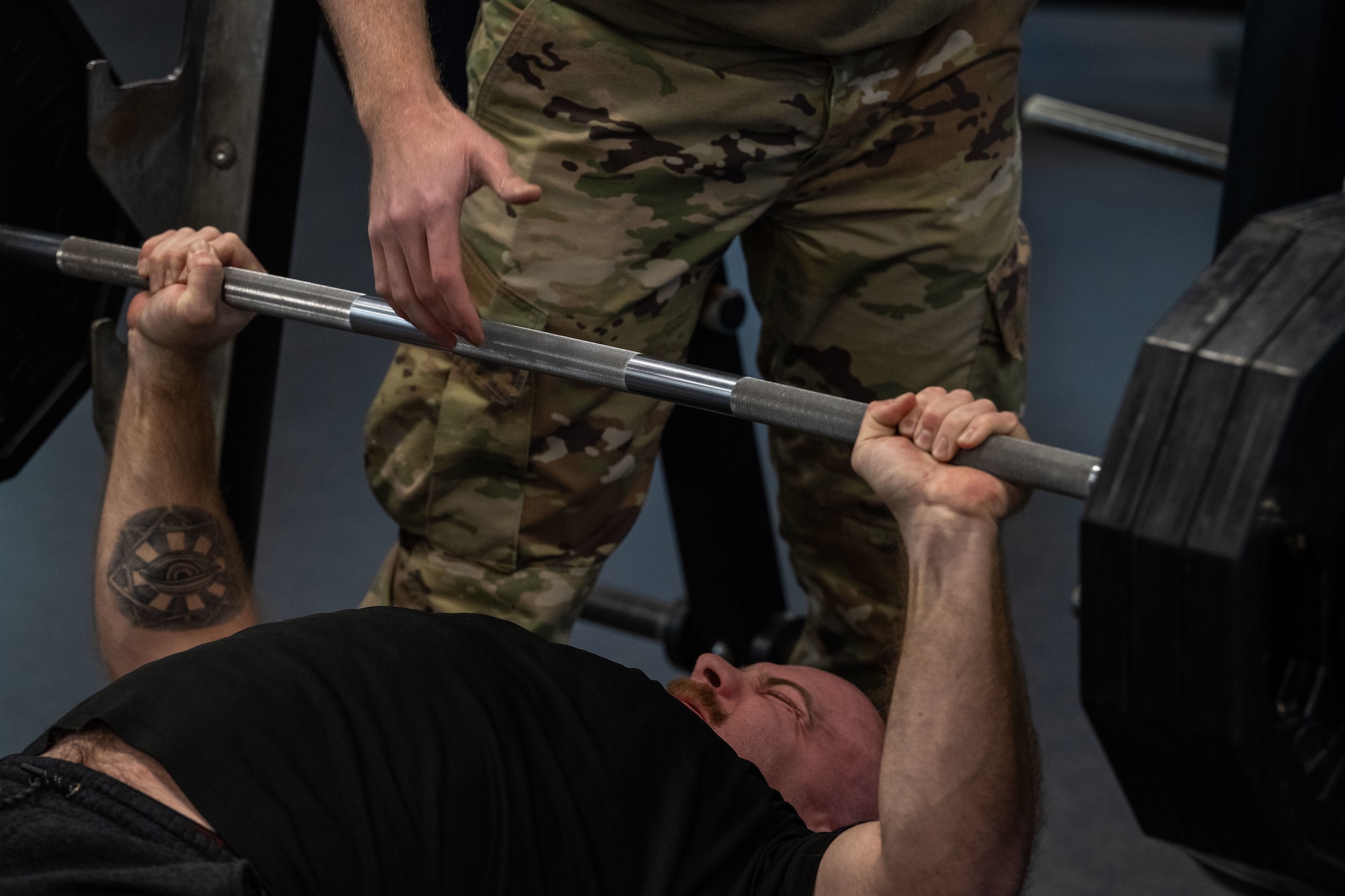 Airman 1st Class Braden York, 722nd Aircraft Maintenance Squadron crew chief, performs a bench press during a base weightlifting competition Dec. 11, 2024, at McConnell Air Force Base, Kansas. The 22nd Force Support Squadron hopes to make the weightlifting competition a recurring annual event. (U.S. Air Force photo by Airman 1st Class Paula Arce)