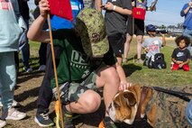 U.S. Marine Corps Lance Cpl. Bruno, the Marine Corps Recruit Depot San Diego and Western Recruiting Region mascot, greets a guest during a Devil Pups event at Marine Corps Recruit Depot San Diego, California, Dec. 14, 2024. The Devil Pups event is held in order to allow participants, aged five to twelve-years-old, to learn about Marine Corps culture, history, and traditions. This program is also a part of the Lifestyle, Insight, Network, Knowledge, and Skills Program, an interactive acculturation program to the Marine Corps lifestyle. (U.S. Marine Corps photo by Lance Cpl. Jacob B. Hutchinson)