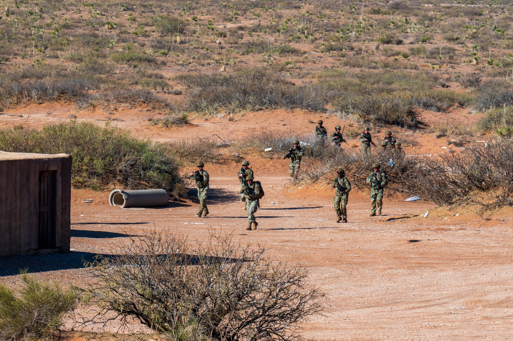 U.S. Air Force security forces Defenders assigned to the 13th Combat Air Base Squadron assault a simulated village during the 13th CABS first Air Task Force training event, Dec. 14, 2024, at Camp McGregor, New Mexico.
