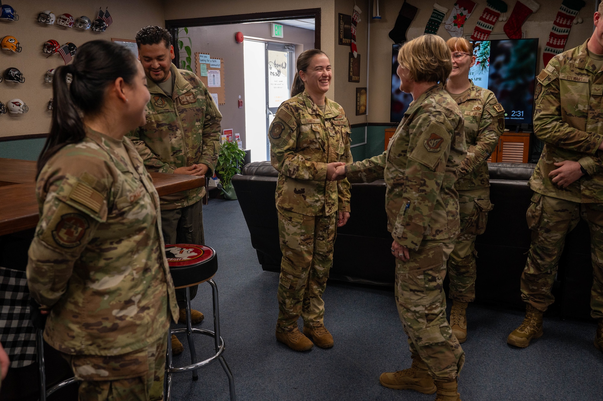 Service member receives coin.