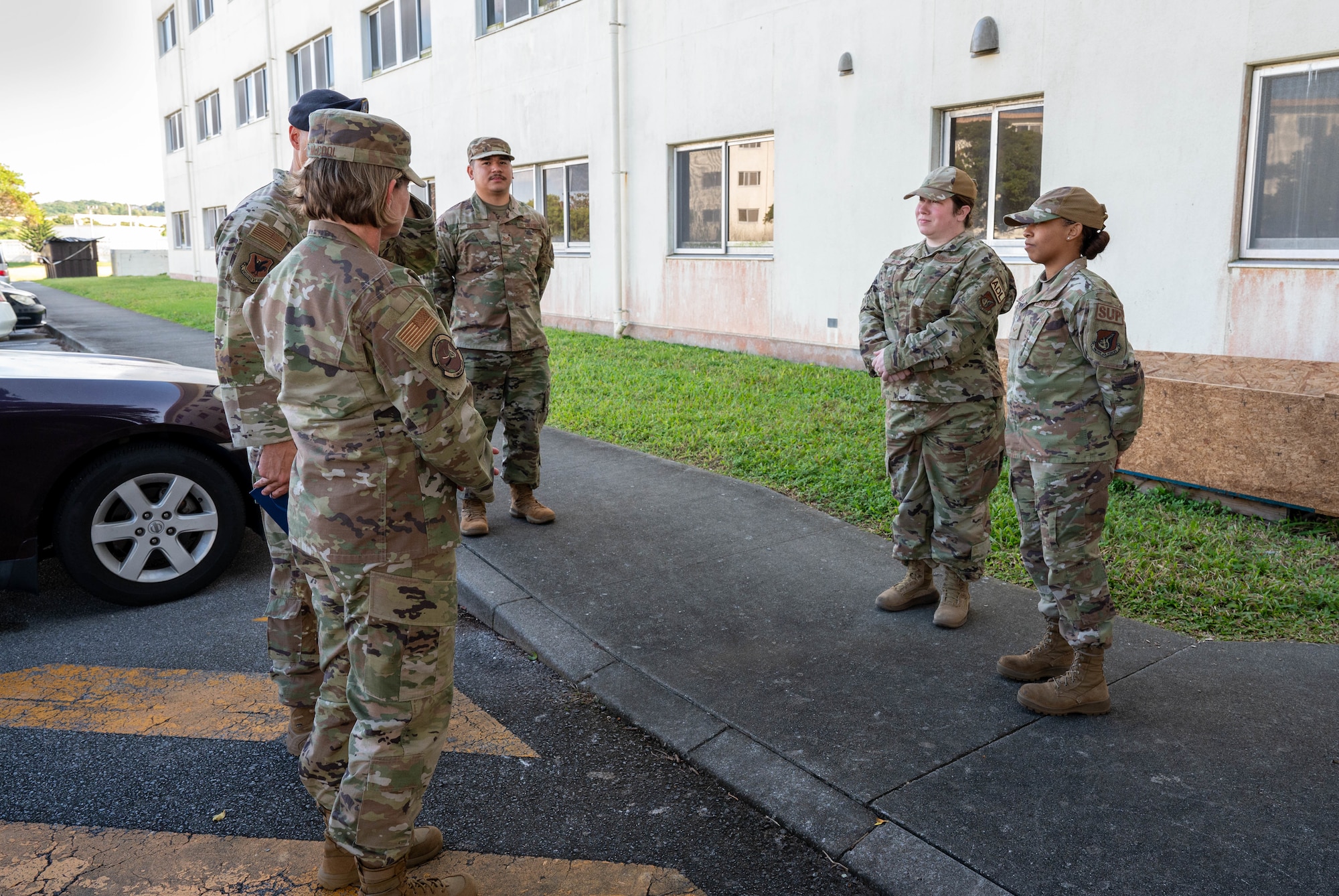 Service members speak together.