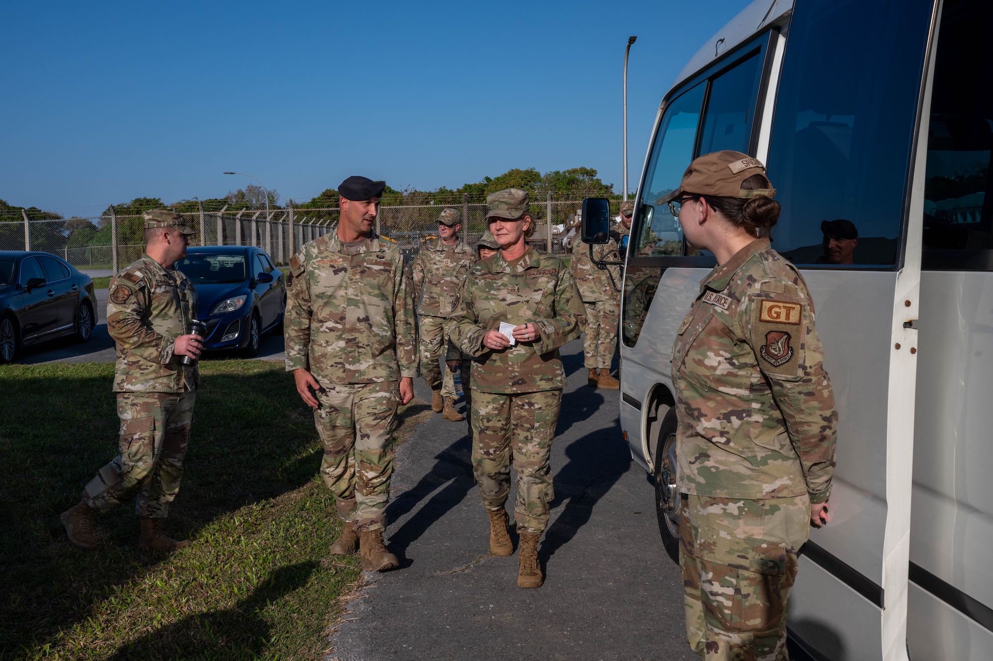 Service members speaking to each other.