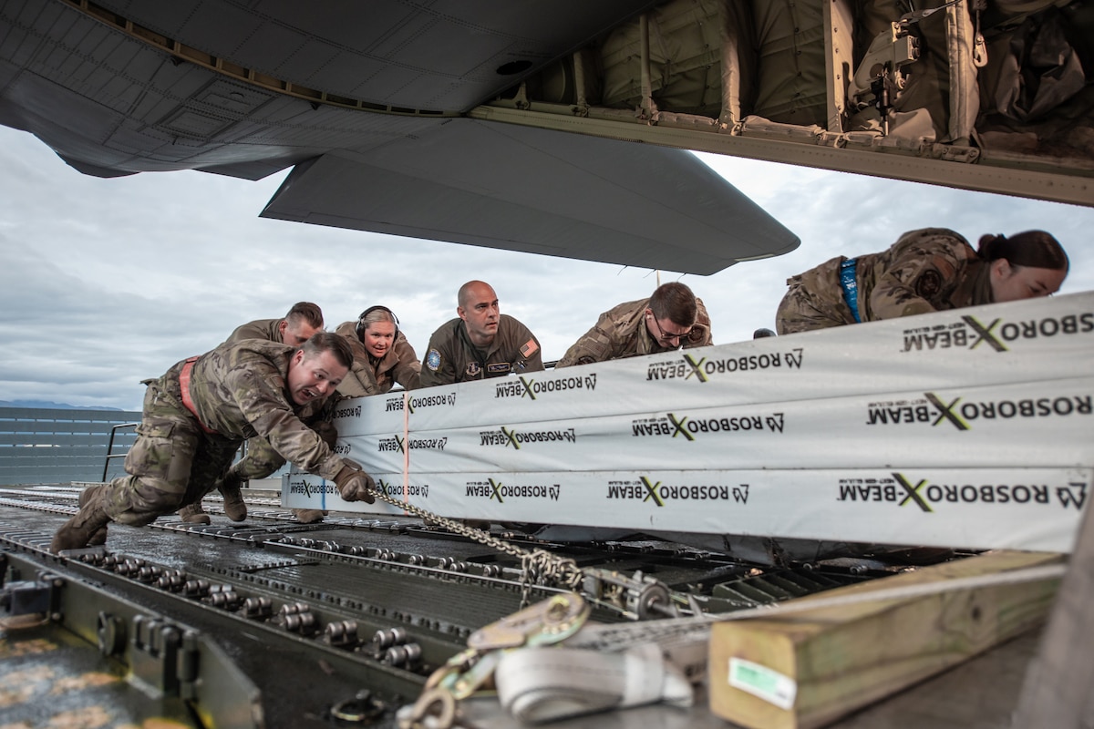 Members of the 123rd Airlift Wing upload cargo to a Kentucky Air National Guard C-130J Super Hercules aircraft in support of Operation Arctic Haven at Joint Base Elmendorf-Richardson, Alaska, Sept. 2, 2024. Thirty-six wing Airmen supported the Innovative Readiness Training mission, which airlifted 39 short tons of residential building supplies to two remote villages in northern Alaska. (U.S. Air National Guard photo by Tech. Sgt. Chloe Ochs)