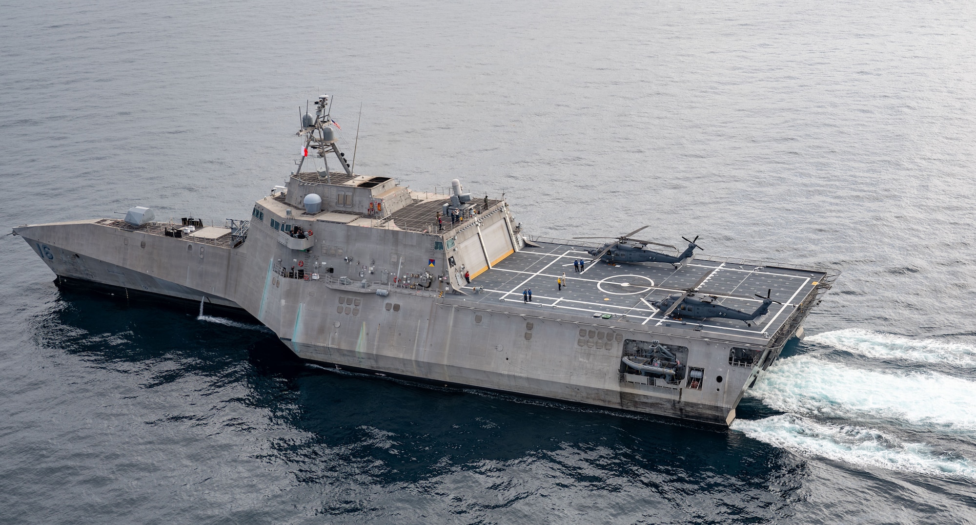 U.S Air Force HH-60W Jolly Green II helicopters land on littoral combat ship USS Tulsa (LCS 16)